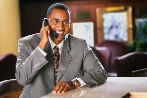 Man smiling on the telephone