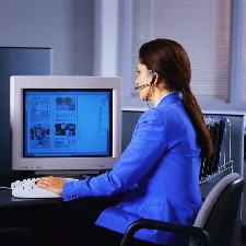 Woman with headphones working on computer